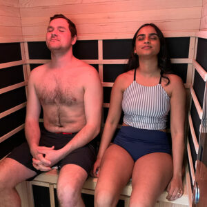 Couple enjoying the soothing sensation of an infrared sauna at Ritual Nordic Spa